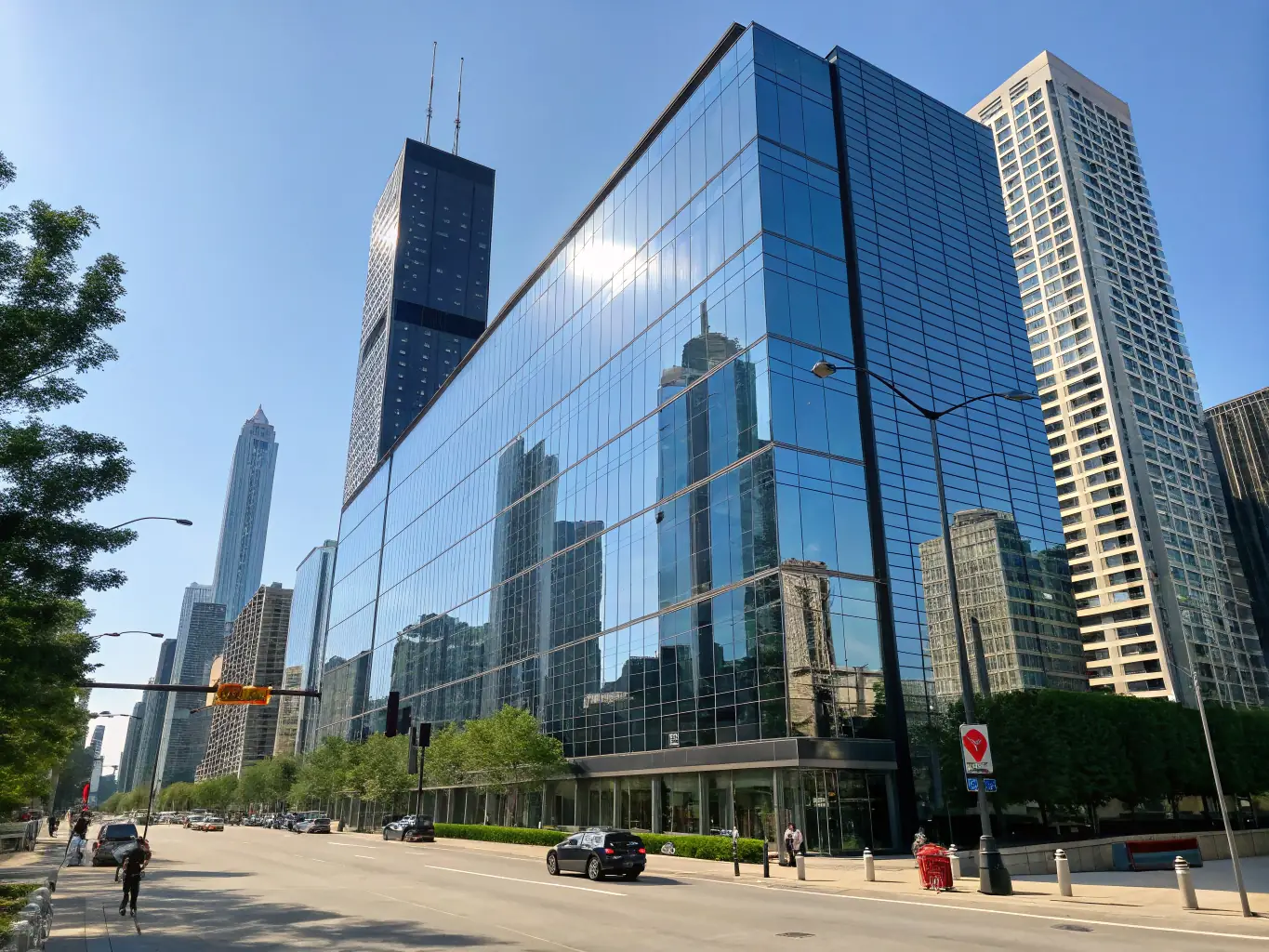 A contemporary office building with sleek architecture, featuring collaborative workspaces and modern amenities, set against a backdrop of the city skyline.
